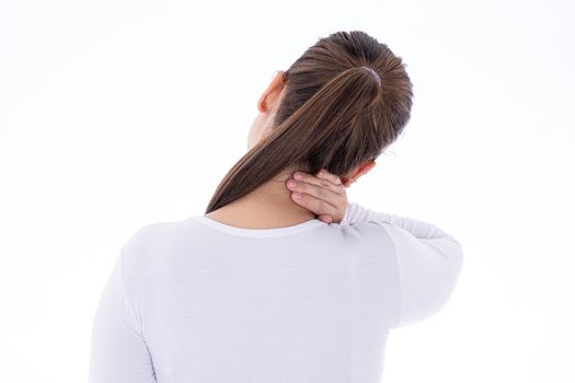 A woman feeling exhausted and suffering from shoulder and neck pain and injury on isolated white background. Health care and medical concept.