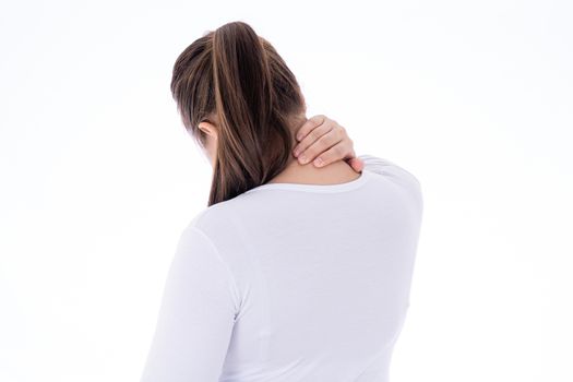 A woman feeling exhausted and suffering from shoulder and neck pain and injury on isolated white background. Health care and medical concept.