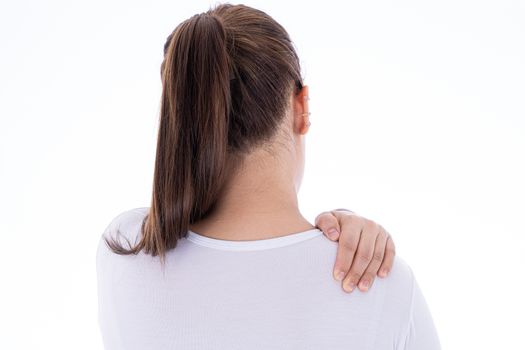 A woman feeling exhausted and suffering from shoulder and neck pain and injury on isolated white background. Health care and medical concept.