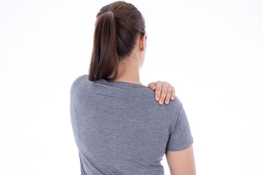 A woman feeling exhausted and suffering from shoulder and neck pain and injury on isolated white background. Health care and medical concept.