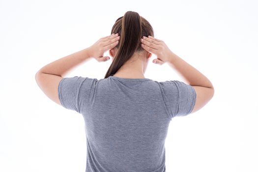 A woman feeling exhausted and suffering from neck and head pain and injury on isolated white background. Health care and medical concept.