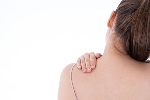 A woman feeling exhausted and suffering from shoulder and neck pain and injury on isolated white background. Health care and medical concept.