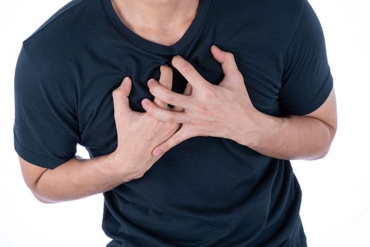 A man feeling exhausted and suffering from heart pain and injury on isolated white background. Health care and medical concept.