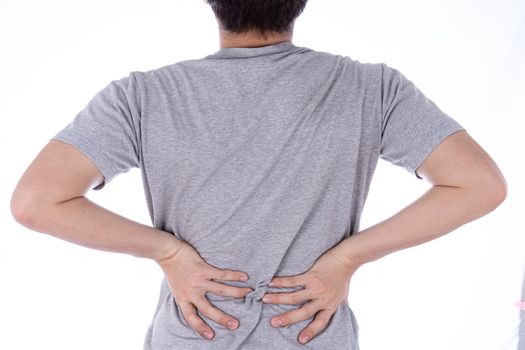A man feeling exhausted and suffering from waist and back pain and injury on isolated white background. Health care and medical concept.