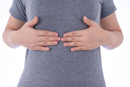 A woman feeling exhausted and suffering from stomach pain and injury on isolated white background. Health care and medical concept.
