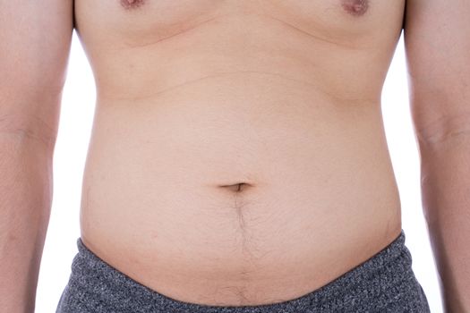 Close up the excessive fat belly on isolated white background. Man overweight abdomen. Man diet lifestyle concept reduce belly and shape up healthy stomach muscle. Weight loss, slim body concept.