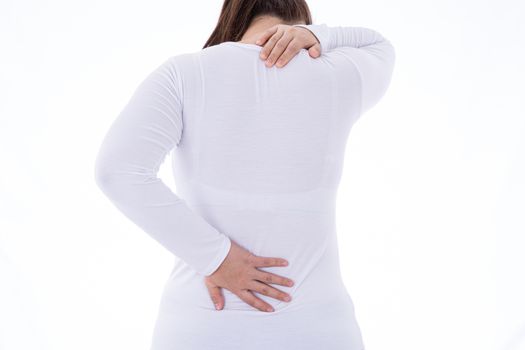 A woman feeling exhausted and suffering from neck and back pain and injury on isolated white background. Health care and medical concept.