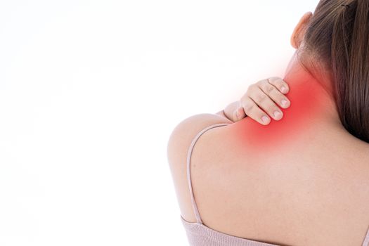 A woman feeling exhausted and suffering from shoulder and neck pain and injury on isolated white background with red spot. Health care and medical concept.