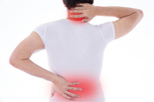 A man feeling exhausted and suffering from neck and back pain and injury on isolated white background with red spot. Health care and medical concept.