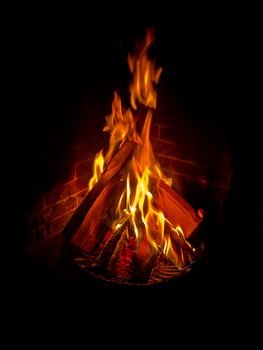 Black background with Fire in the evening in dark surroundings.