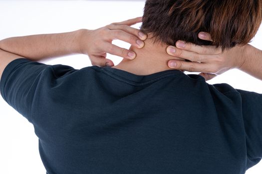 A man feeling exhausted and suffering from shoulder and neck pain and injury on isolated white background. Health care and medical concept.