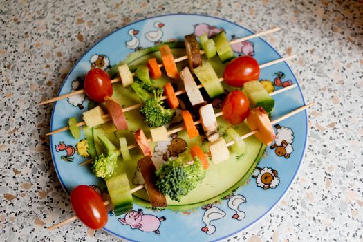 Healthy food. Make vegetables and fruits tasty for children with vegetable skewers.