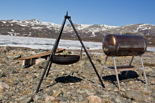 Norway landscape, snow and mountains with barbecue area in the barren wilderness.