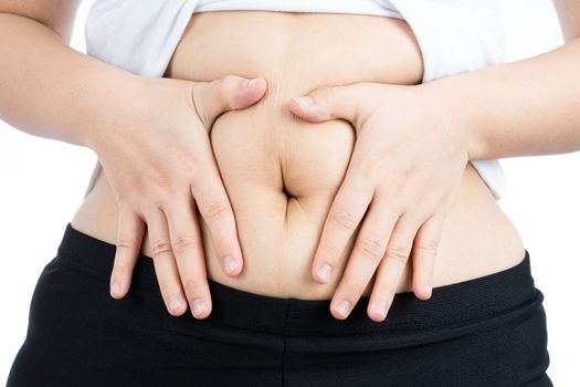 Fat woman holding excessive fat belly, overweight fatty belly isolated on over white background. Diet lifestyle, weight loss, stomach muscle, healthy concept.