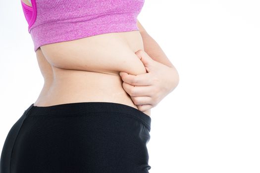 Fat woman holding excessive fat belly lower back, overweight fatty belly isolated on over white background. Diet lifestyle, weight loss, stomach muscle, healthy concept.