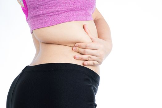 Fat woman holding excessive fat belly lower back, overweight fatty belly isolated on over white background. Diet lifestyle, weight loss, stomach muscle, healthy concept.