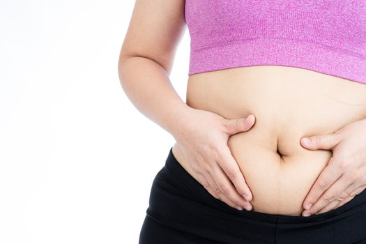Fat woman holding excessive fat belly, overweight fatty belly isolated on over white background. Diet lifestyle, weight loss, stomach muscle, healthy concept.