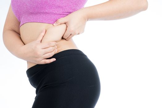 Fat woman holding excessive fat belly lower back, overweight fatty belly isolated on over white background. Diet lifestyle, weight loss, stomach muscle, healthy concept.