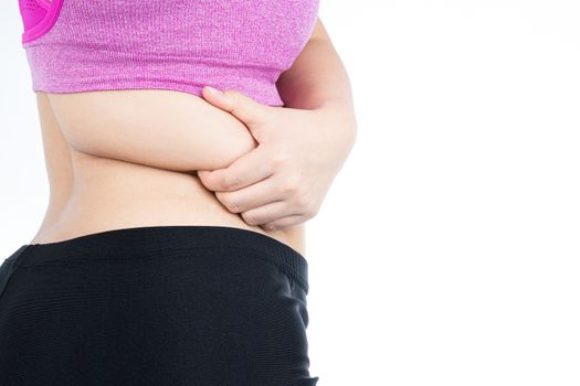 Fat woman holding excessive fat belly lower back, overweight fatty belly isolated on over white background. Diet lifestyle, weight loss, stomach muscle, healthy concept.