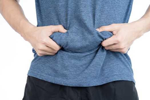 Fat man holding excessive fat belly, overweight fatty belly isolated on over white background. Diet lifestyle, weight loss, stomach muscle, healthy concept.