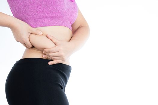 Fat woman holding excessive fat belly lower back, overweight fatty belly isolated on over white background. Diet lifestyle, weight loss, stomach muscle, healthy concept.