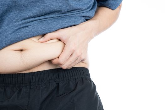 Fat man holding excessive fat belly, overweight fatty belly isolated on over white background. Diet lifestyle, weight loss, stomach muscle, healthy concept.