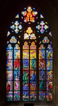PRAGUE, CZECH REPUBLIC - FEBRUARY 19, 2015 - Stained-glass window in St Vitus Cathedral, depicting the adoration of Christ