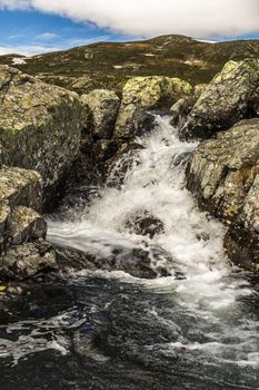 Vavatn Lake and a small waterfall in Buskerud, Hemsedal, Norway