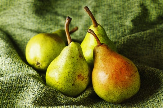 Beautiful green pears on green cotton cloth , macro lens ,