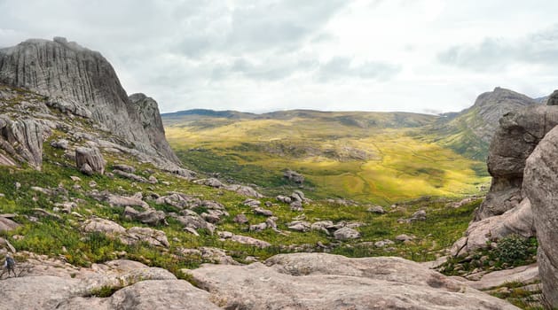 View from Andringitra massif as seen during trek to Pic Boby Imarivolanitra, Madagascar highest accessible peak. Small person in bottom left corner for scale.