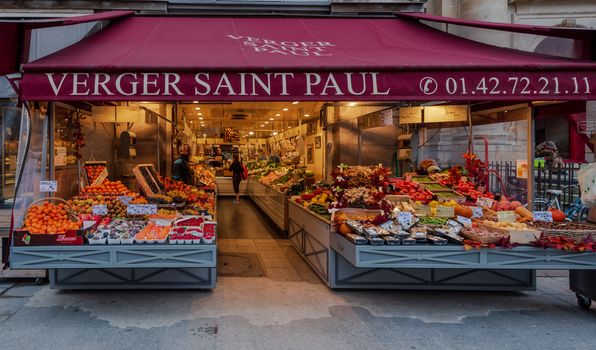 Marais, Paris, France --November 4, 2017. A close-up wide angle photo taken at the entrance to a food shop in the Marais section of Paris.