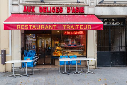 Paris, France -- November 4, 2017. A wide angle photos of a restaurant exterior on Rue St Antoine in Paris.