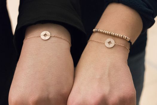 Friendship bracelets with compass and cardinal points in bronze for girls.