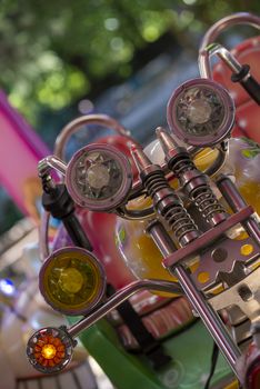 detail of a carousel in the park with various colors