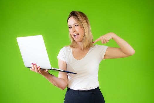 Pretty young woman in white shirt using a computer