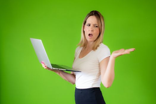 Pretty young woman in white shirt using a computer