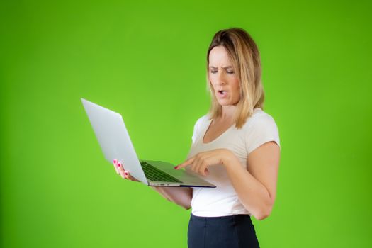 Pretty young woman in white shirt using a computer