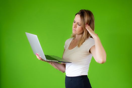 Pretty young woman in white shirt using a computer