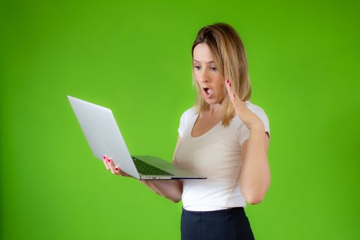 Pretty young woman in white shirt using a computer