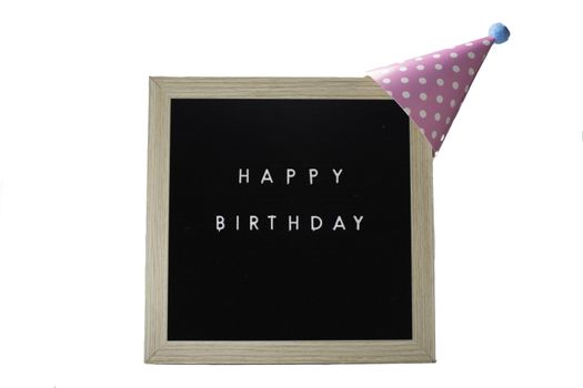 A Birch Framed Sign That Says Happy Birthday in White Letters With a Pink Party Hat on Top on a Pure White Background