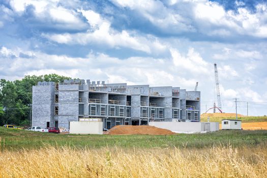 Horizontal shot of a; multi-story commercial building construction site.