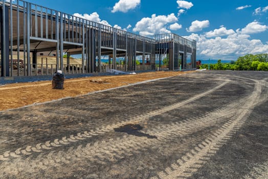 Horizontal shot of a new commercial building under construction.