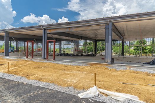 Horizontal shot of a new commercial office building under construction.