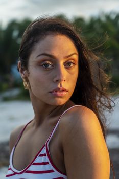 A beautiful brunette model enjoys the sunset in the Yucatán Peninsula near Merida, Mexico