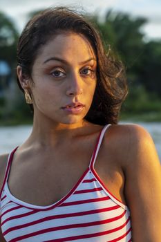 A beautiful brunette model enjoys the sunset in the Yucatán Peninsula near Merida, Mexico