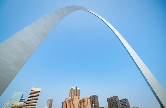 St Louis Gateway Arch symbolically reaching over city's downtown skyline, Missouri USA