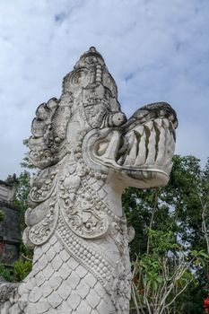 Traditional indonesian art and symbol of balinese hindu religion - faces of mythological dragons in front of Lempuyang temple entrance. Bali people culture and asian travel backgrounds.