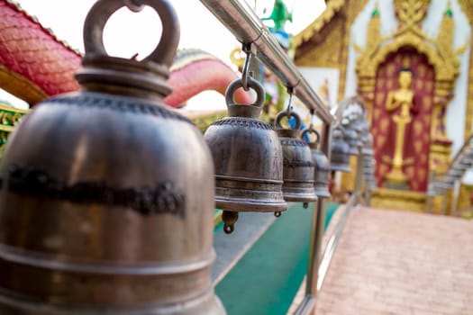 Many bells in the temple allow people to strike to make a loud noise.