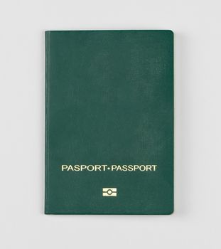 green passport on a white background, isolated, top view
