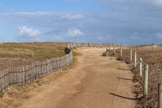 Sandy road along the coast of the peninsula Quiberon, Brittany, France